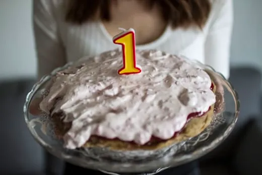 A birthday cake with a number-one candle