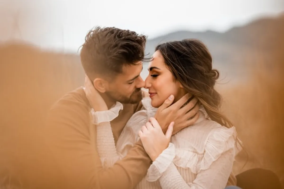 Close-up of a couple laughing in a golden field